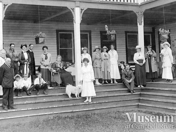 Group on the front steps of the second Heriot Bay Hotel, Quadra Island