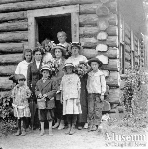 School teacher with pupils at Mansons Landing, Cortes Island