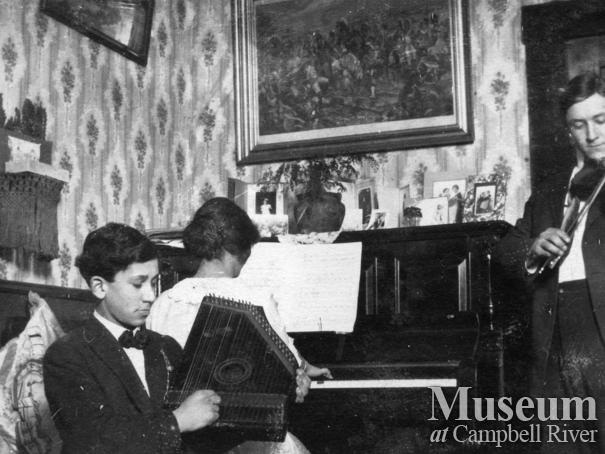 The Yeatman family playing musical instruments in their home