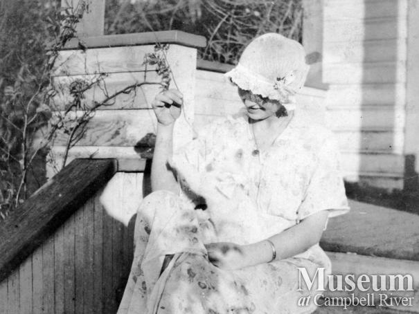 Dot Yeatman on the front steps of the family home, Quadra Island
