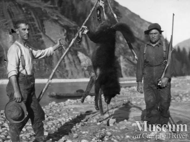 Jack McPhee and Ed Atkins at Bute Inlet with wolf skin 