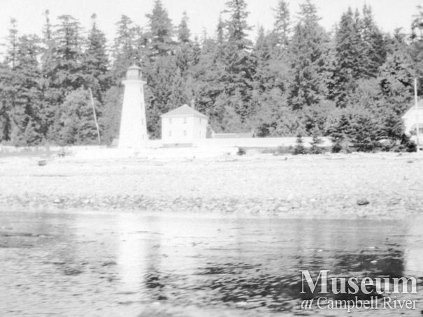 Beach front and lighthouse at Cape Mudge, Quadra Island