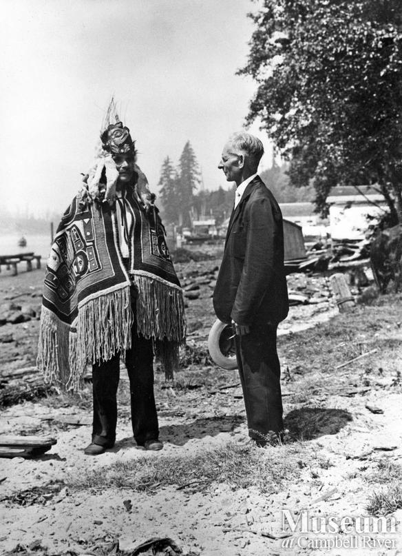 Chief Billy Assu with a missionary on the beach at Cape Mudge Village, Quadra Island