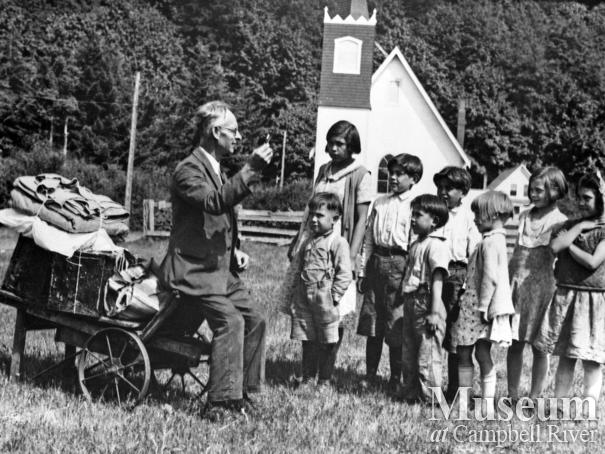 Mr. Pettingell with group of children at Cape Mudge Village