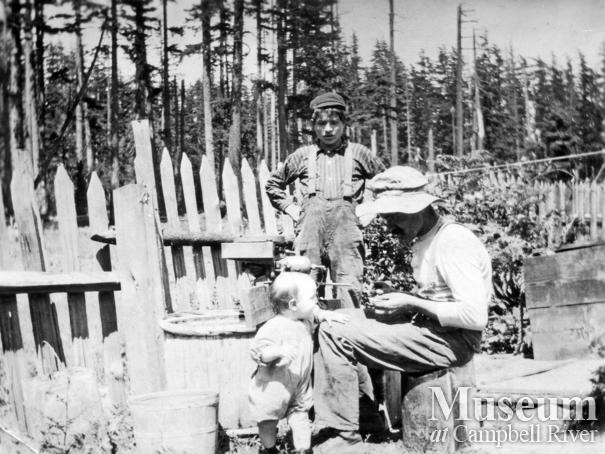 Herbert Joyce Tuning up an Outboard Motor, Quadra Island