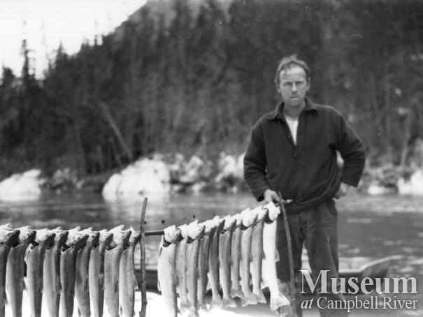 August Schnarr with catch of  trout from Homathko or Southgate River	