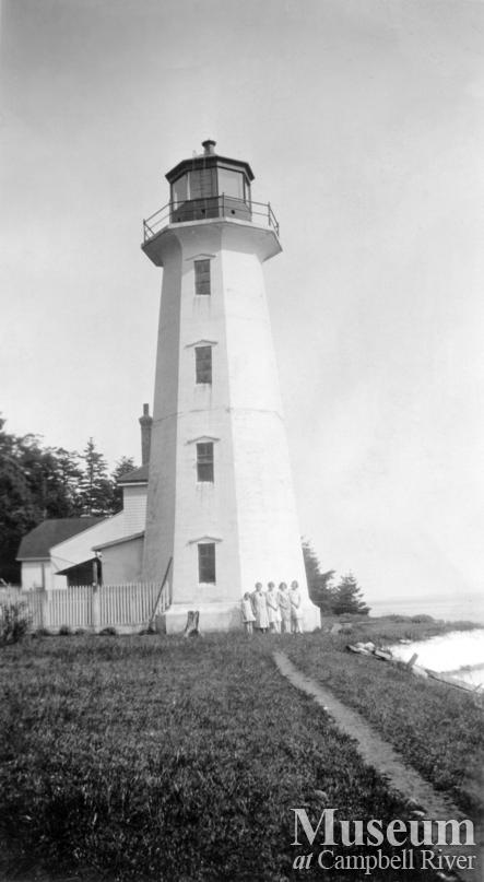 Group standing beside the Lighthouse at Cape Mudge, Quadra Island