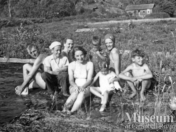 Cortes Island residents on beach in front of the McKay house, Gunflint Lake
