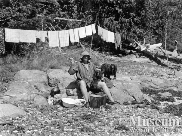 Amy Barrow doing laundry on the beach at Klaoitsis Island