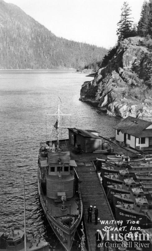 Navy boats tied up at dock at Stuart Island