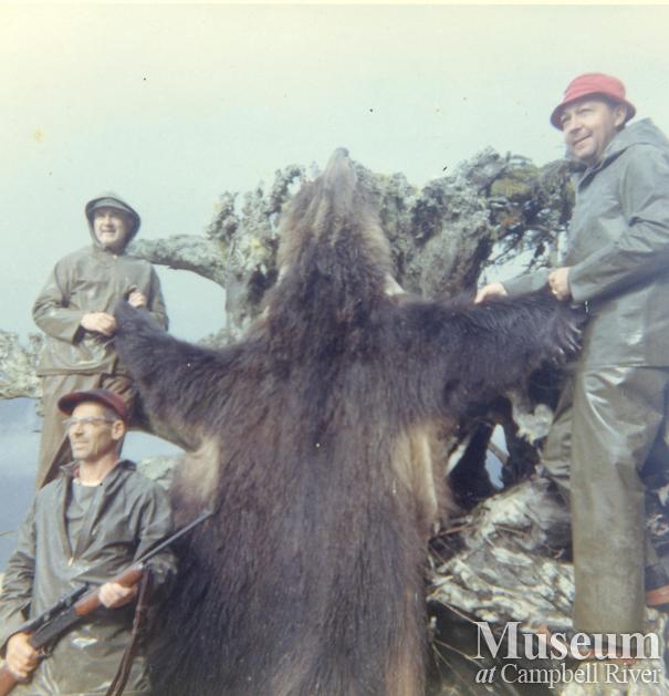 Hunters in Knight Inlet area with grizzly hide