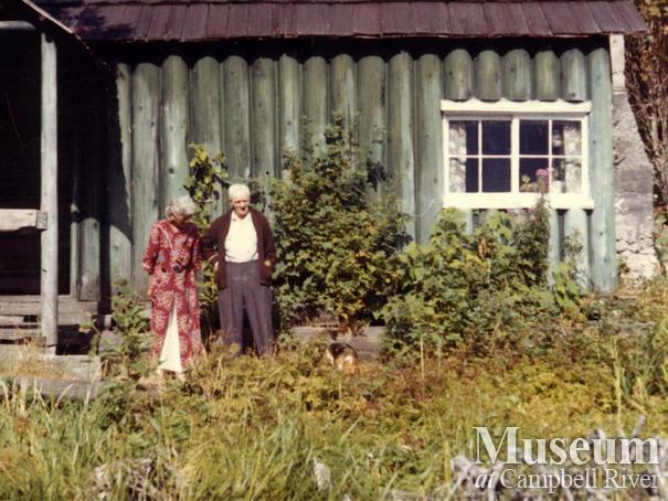 Jim and Laurette Stanton in front of their home, Knight Inlet, B.C.