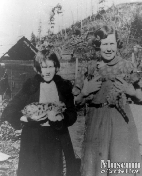 Pansy Schnarr and Mrs. Godkin with baby cougars