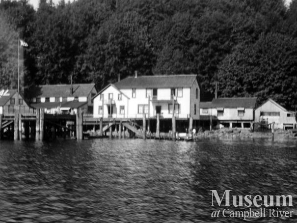 View of buildings at Quathiaski Cove, Quadra Island sometime after 1910