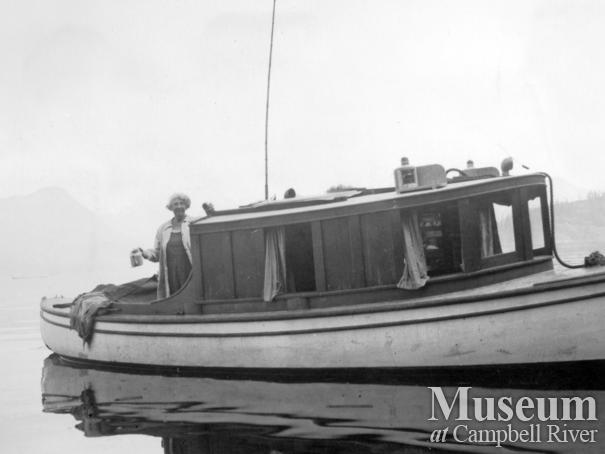 Amy Barrow on the deck of their boat M.V. "Toketie"