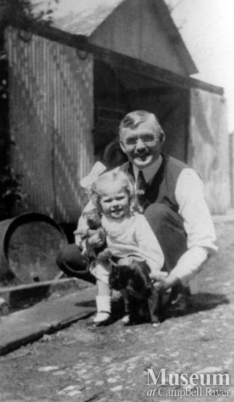 W.E. Anderson with a little girl (Irene Whipple) and cat