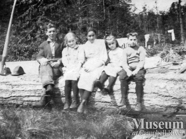 Forrest family children on a log at Shoal Bay