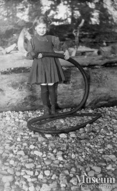 A member of the Marlatt family on the beach, Mary Island