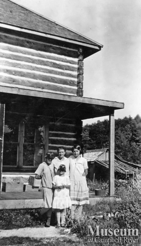 Members of the Hansen family in front of their home at Port Neville