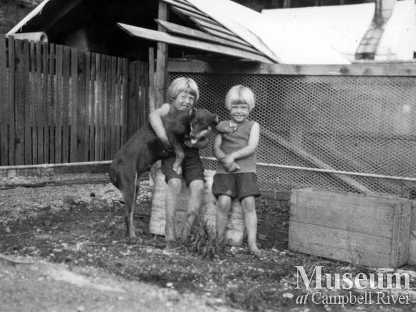 August Schnarr's daughters with dog